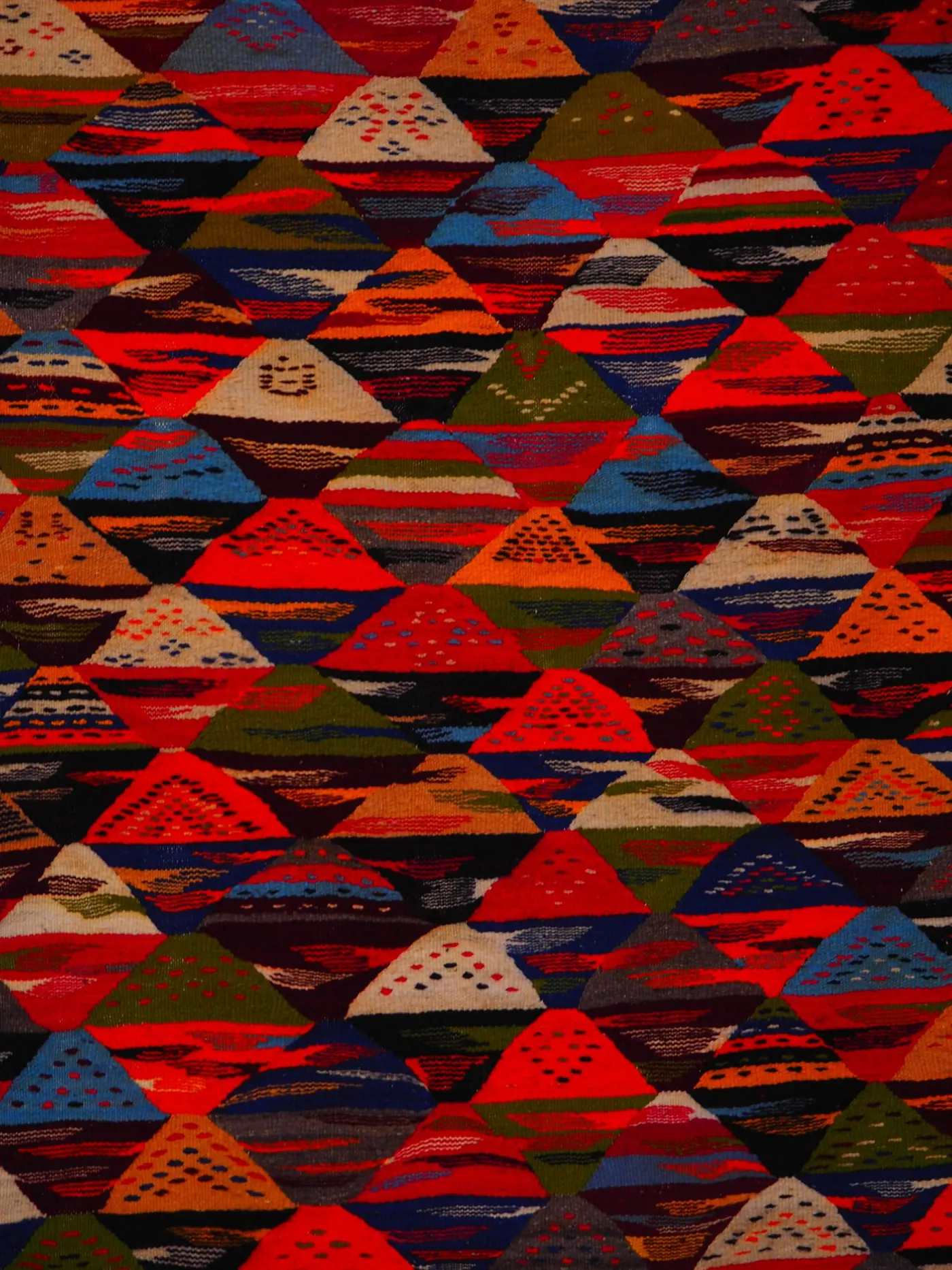 Handwoven kilim rug with traditional geometric pattern
