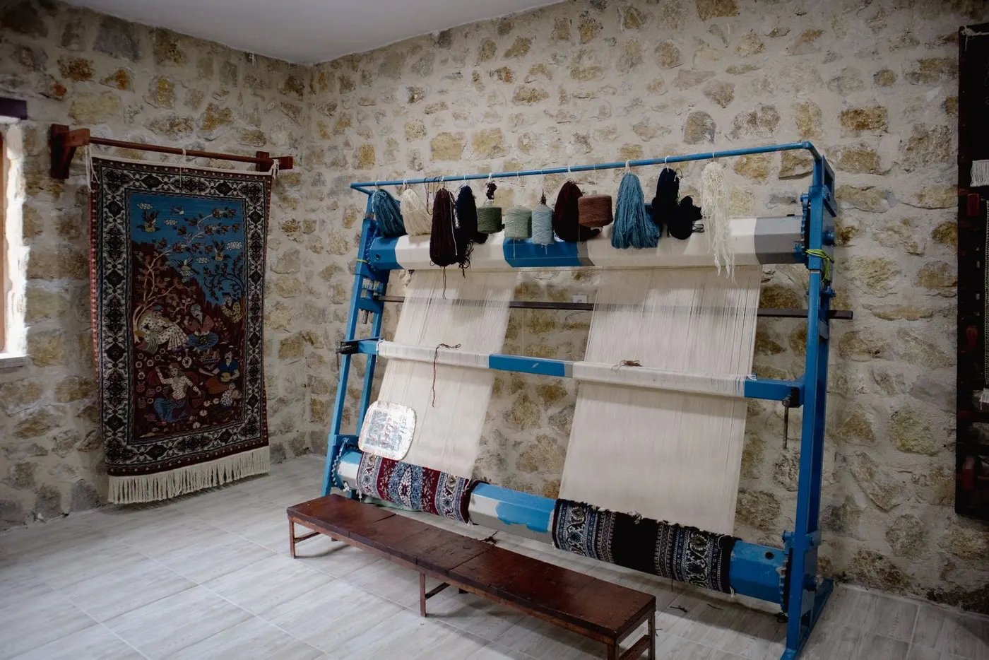 Traditional loom with colourful warp threads