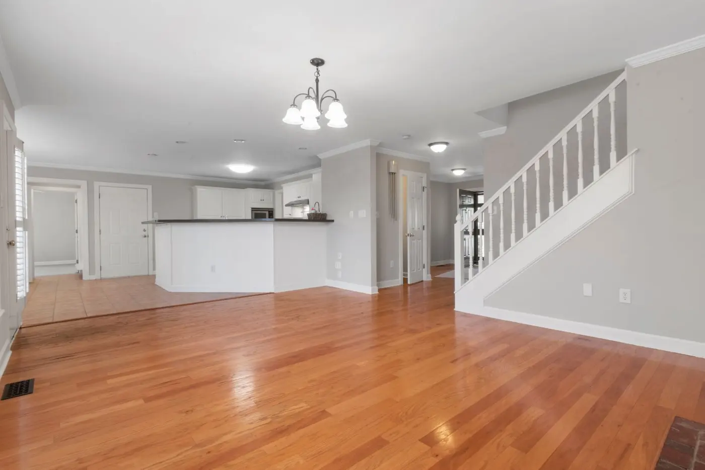 Living room in warm neutral tones with wooden flooring